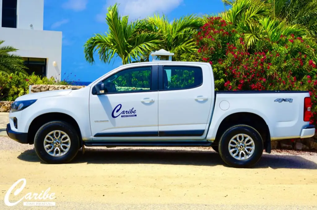 Rental car white chevrolet colorado on bonaire side view