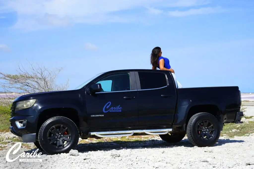 Rental car black chevrolet colorado side view